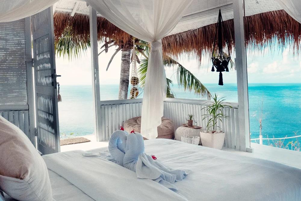 tropical-glamping Tropical Glamping Indonesia - Ocean-view glamping tent at Tropical Glamping Indonesia perched above turquoise cliffs of Nusa Penida island.